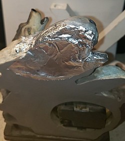 Ceramic wolf clock-frame repair (step 3)